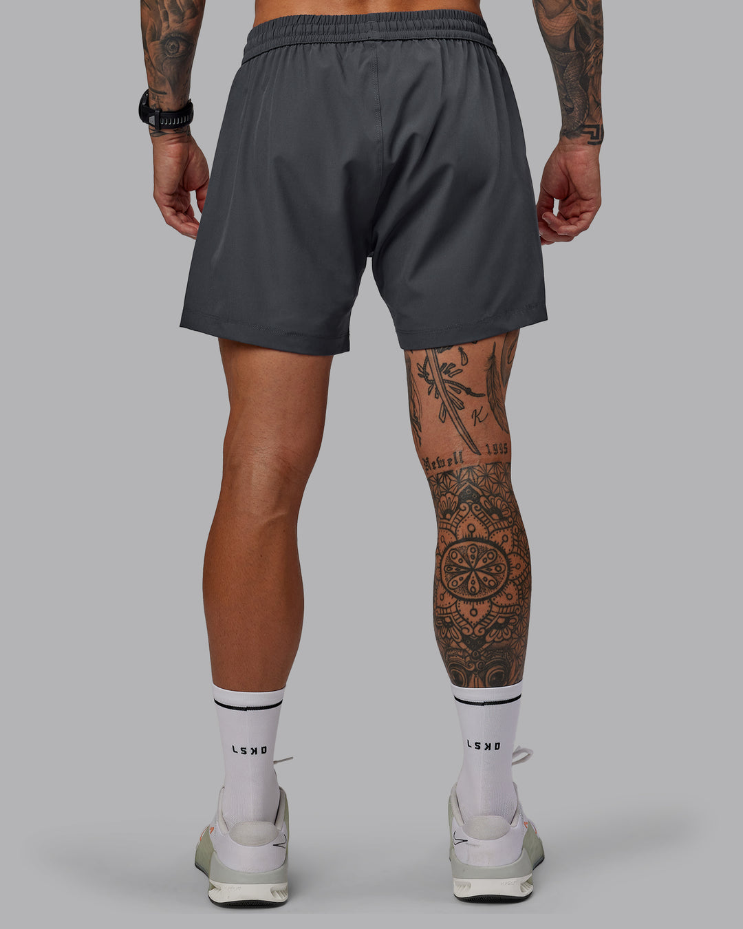 Man wearing Rep 5&quot; Lined Performance Shorts - Dark Storm