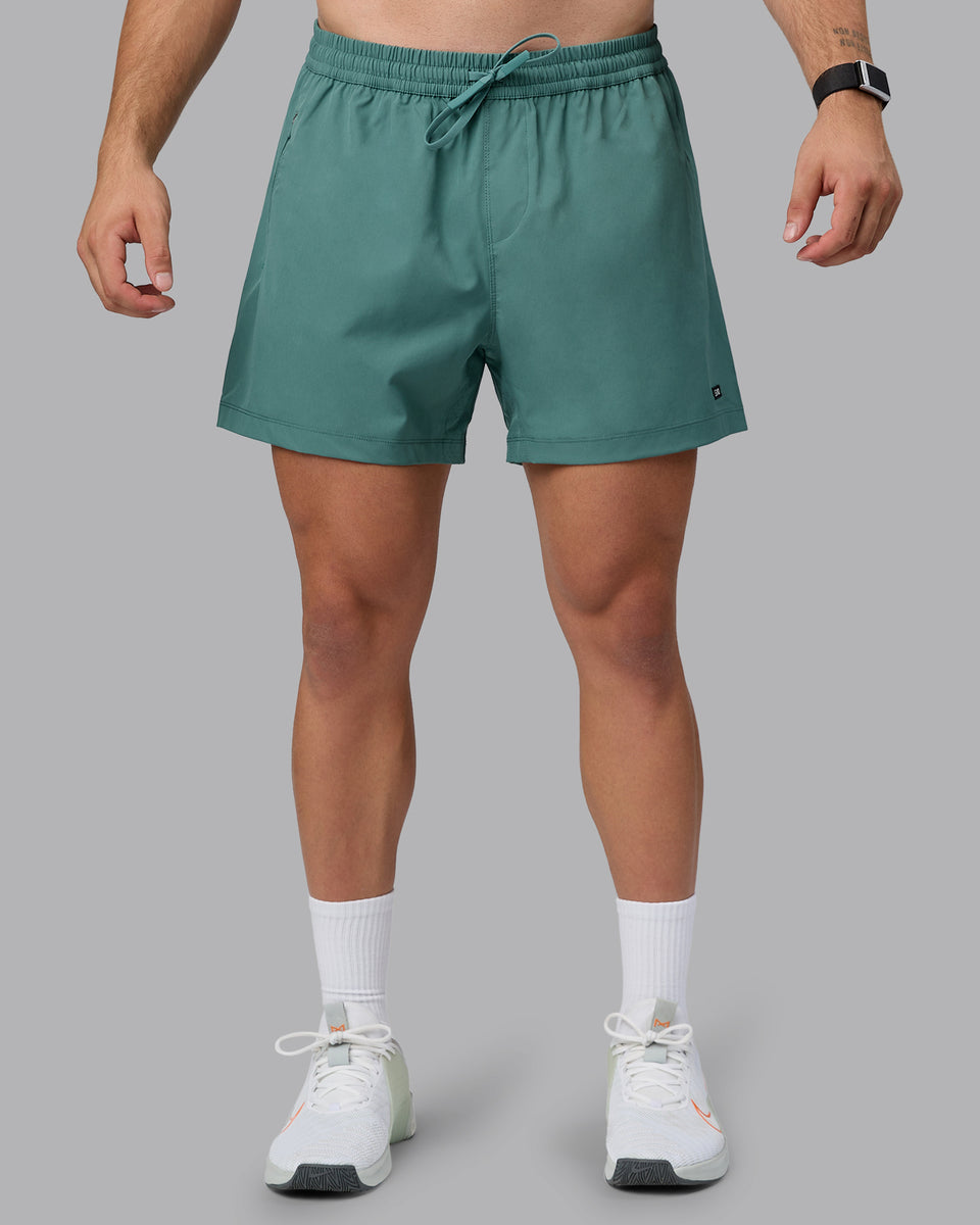 Man wearing Rep 5" Lined Performance Shorts - Sagebrush