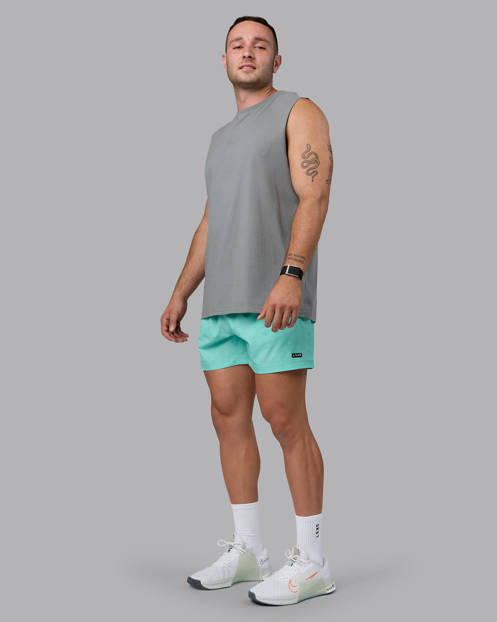 Man wearing Rep 5" Performance Shorts - Digital Camo Cockatoo