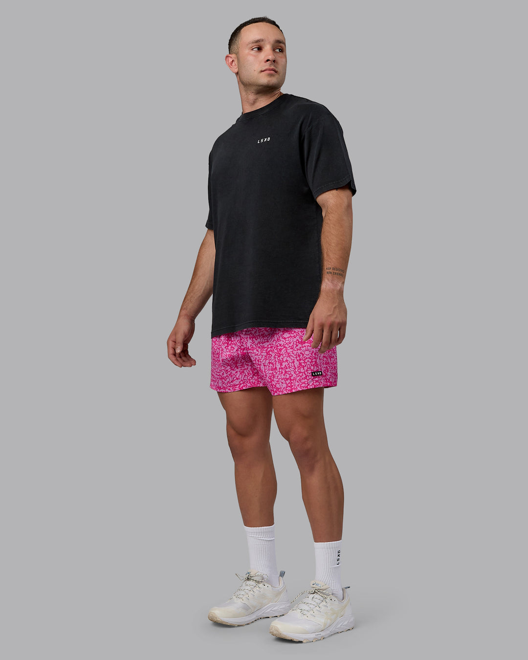 Man wearing Rep 5&quot; Performance Shorts - Patina Pastel Orchid