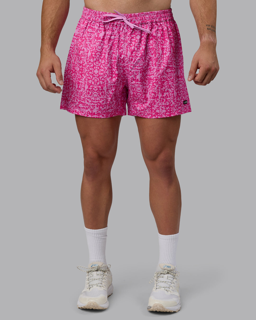 Man wearing Rep 5&quot; Performance Shorts - Patina Pastel Orchid