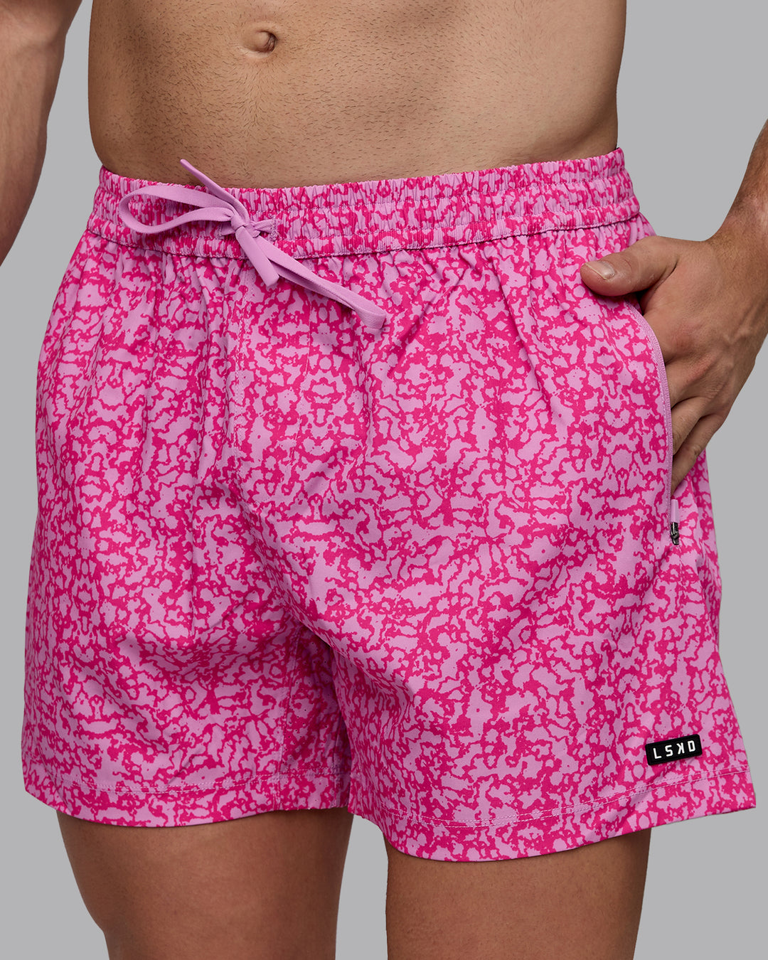 Man wearing Rep 5&quot; Performance Shorts - Patina Pastel Orchid