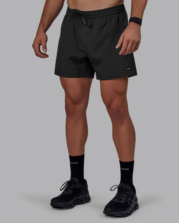 Man wearing Rep 5&quot; Performance Shorts - Pirate Black
