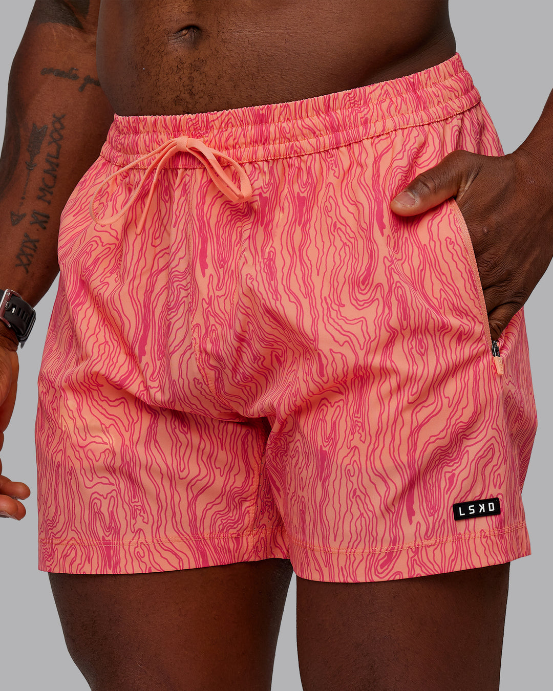 Man wearing Rep 5&quot; Performance Shorts - Topographic Peach