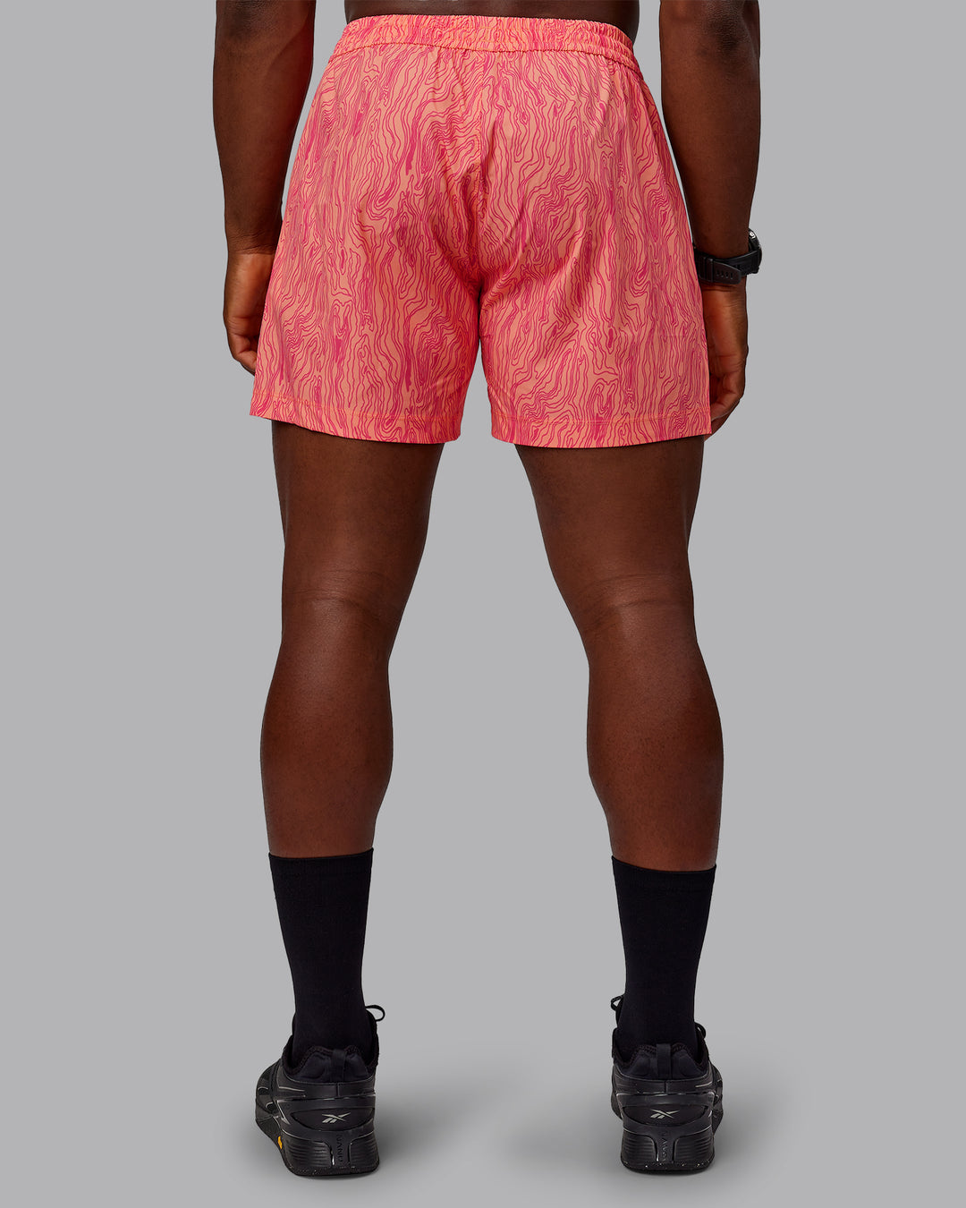 Man wearing Rep 5&quot; Performance Shorts - Topographic Peach