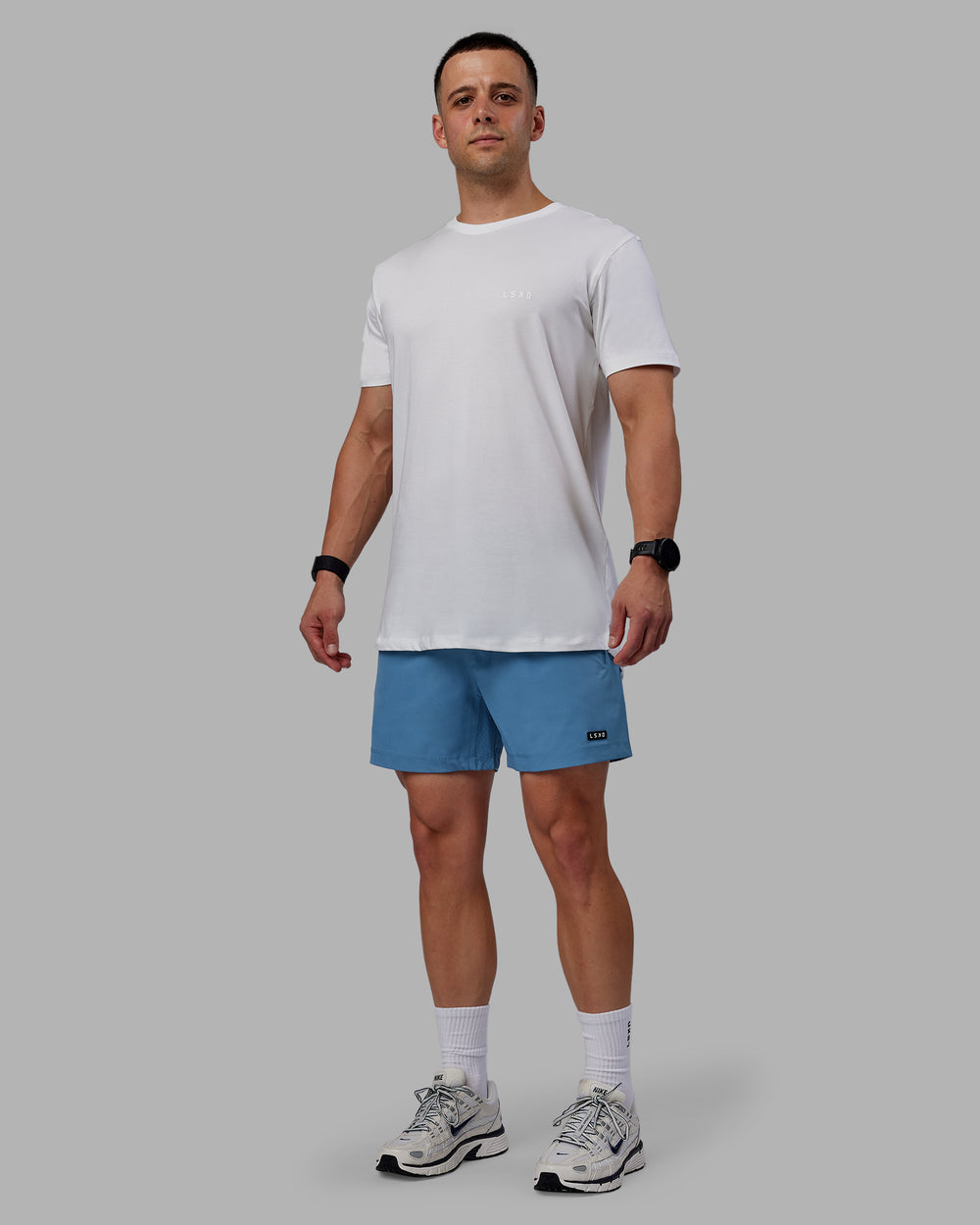 Man wearing Rep 5" Performance Shorts - Elemental Blue