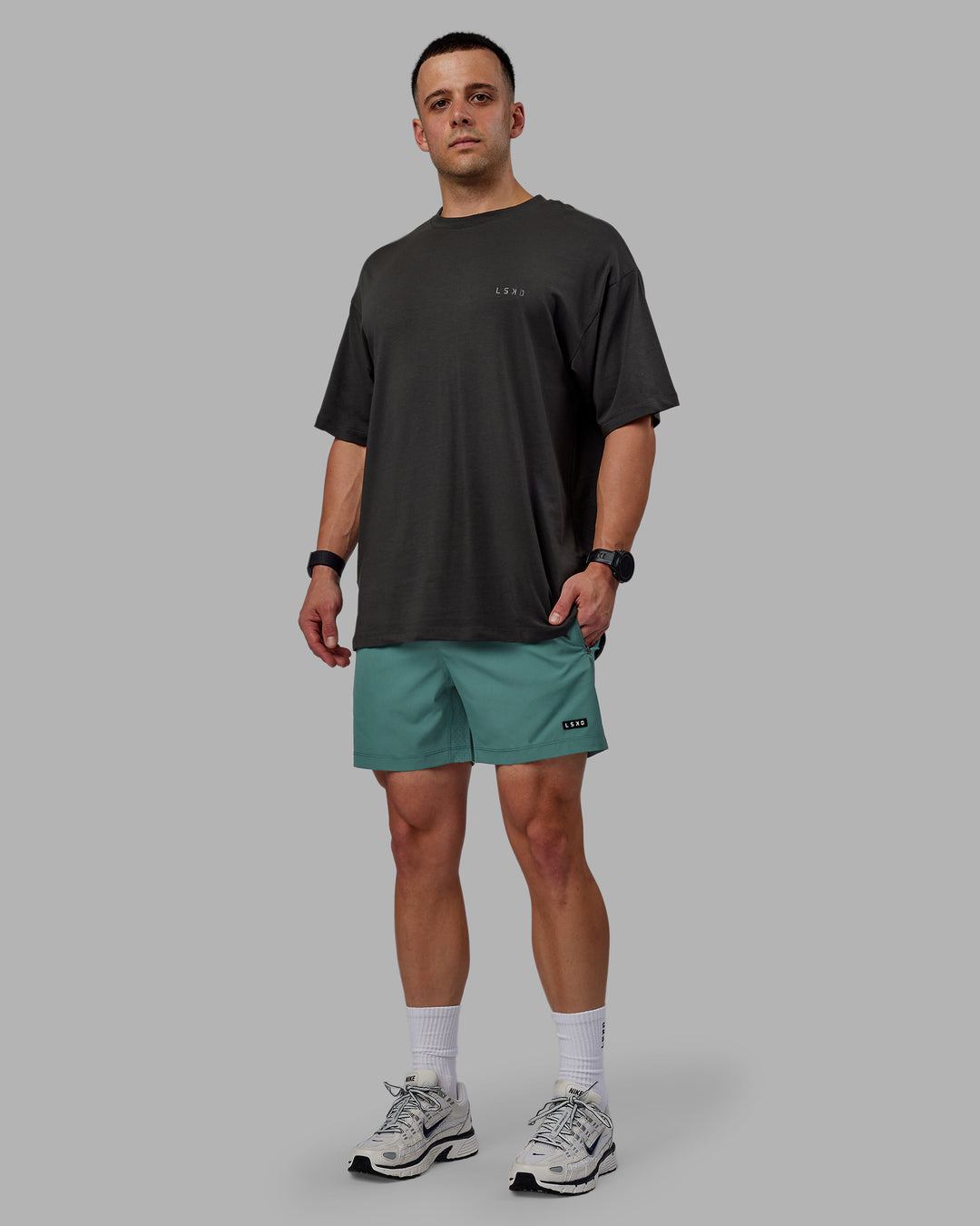 Man wearing Rep 5&quot; Performance Shorts - Sage Bush