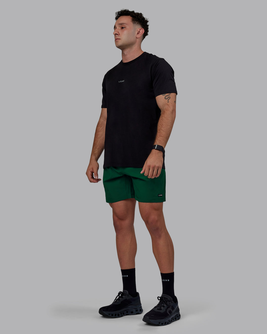 Man wearing Rep 7&quot; Performance Shorts - Deep Emerald