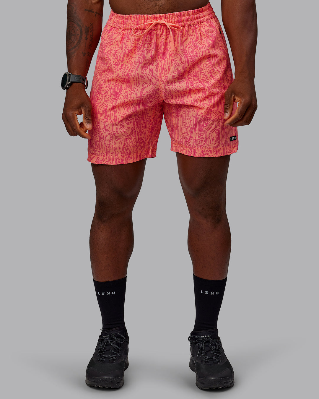 Man wearing Rep 7&quot; Performance Shorts - Topographic Peach