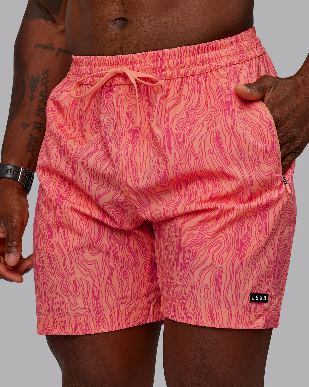 Man wearing Rep 7&quot; Performance Shorts - Topographic Peach