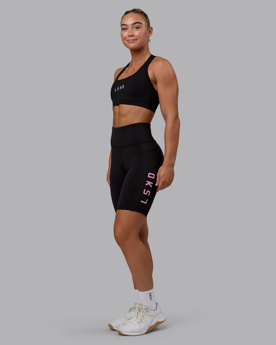 Woman wearing Rep Bike Shorts - Black-Bubblegum