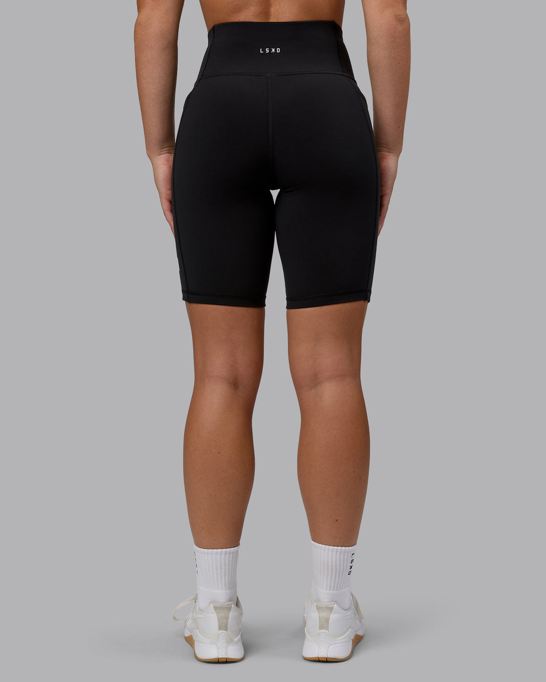 Woman wearing Rep Bike Shorts - Black-Bubblegum