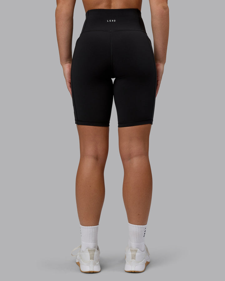 Woman wearing Rep Bike Shorts - Black-Bubblegum
