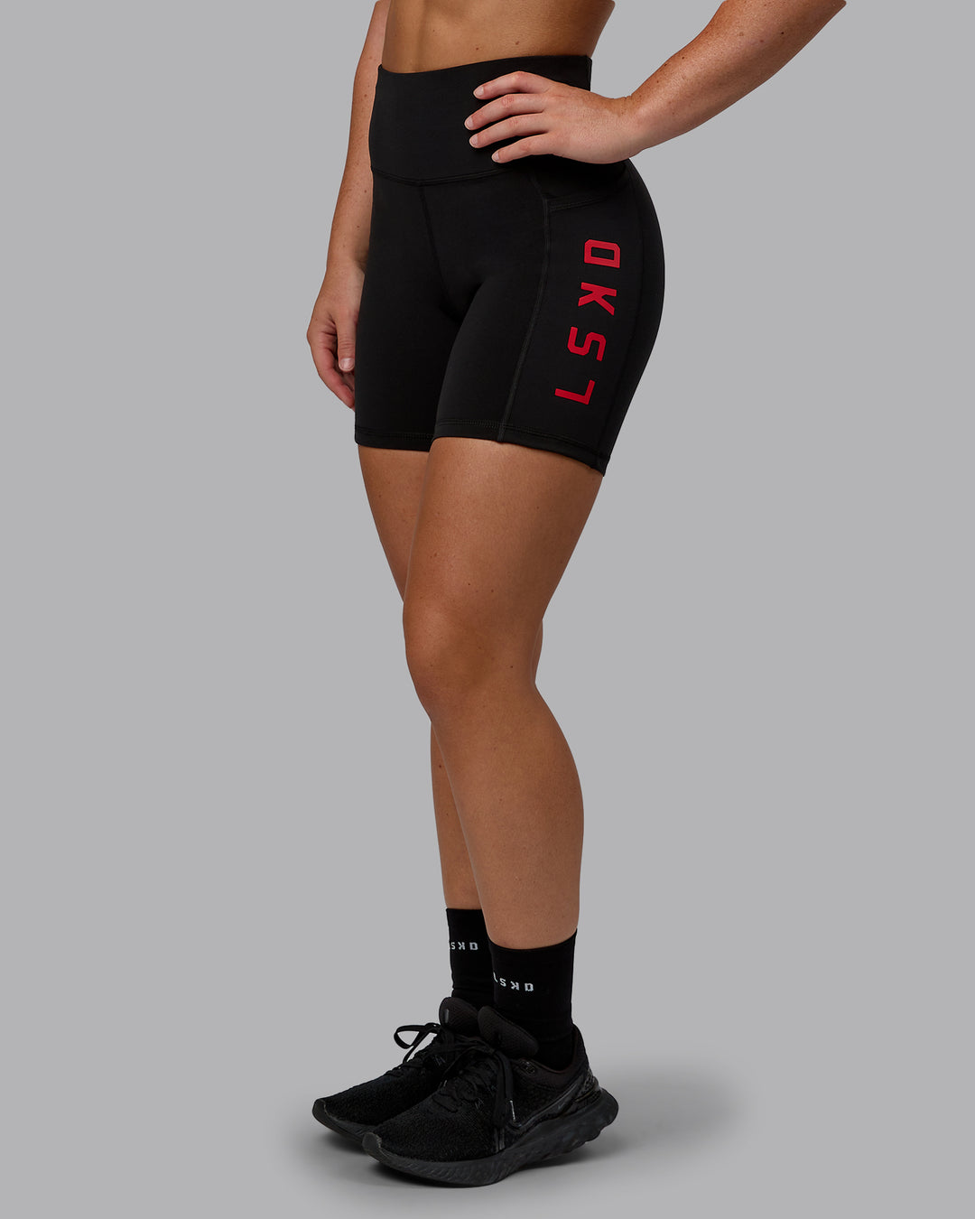 Woman wearing Rep Mid Short Tights - Black-Crimson