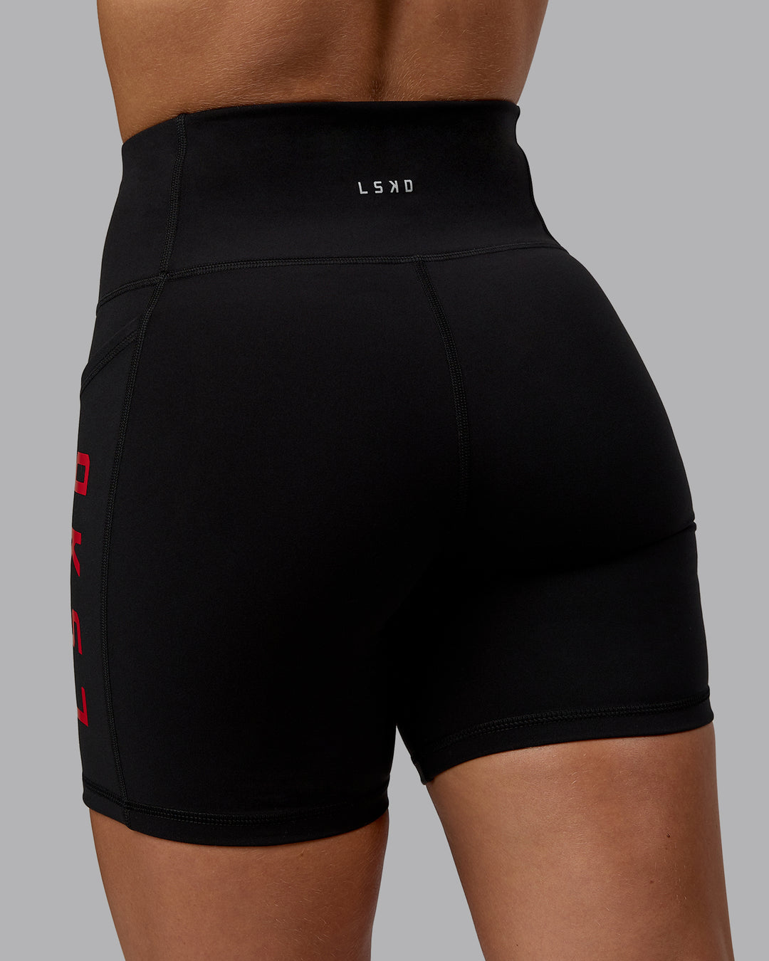 Woman wearing Rep Mid Short Tights - Black-Crimson