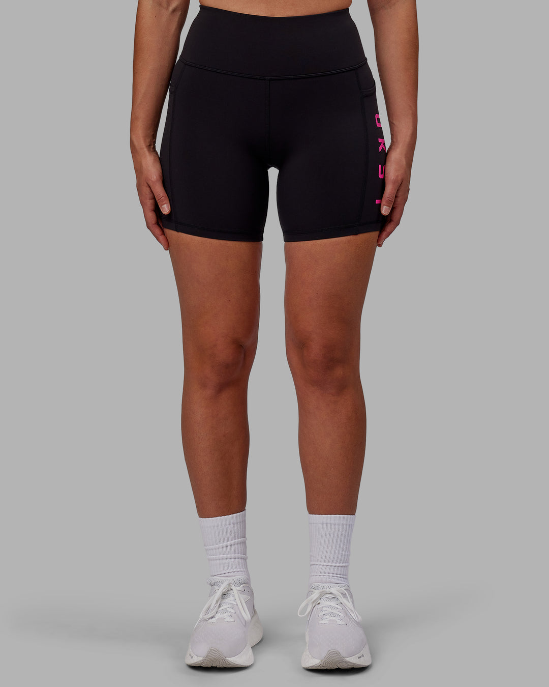 Woman wearing Rep Mid Short Tights - Black-Fuchsia Pink