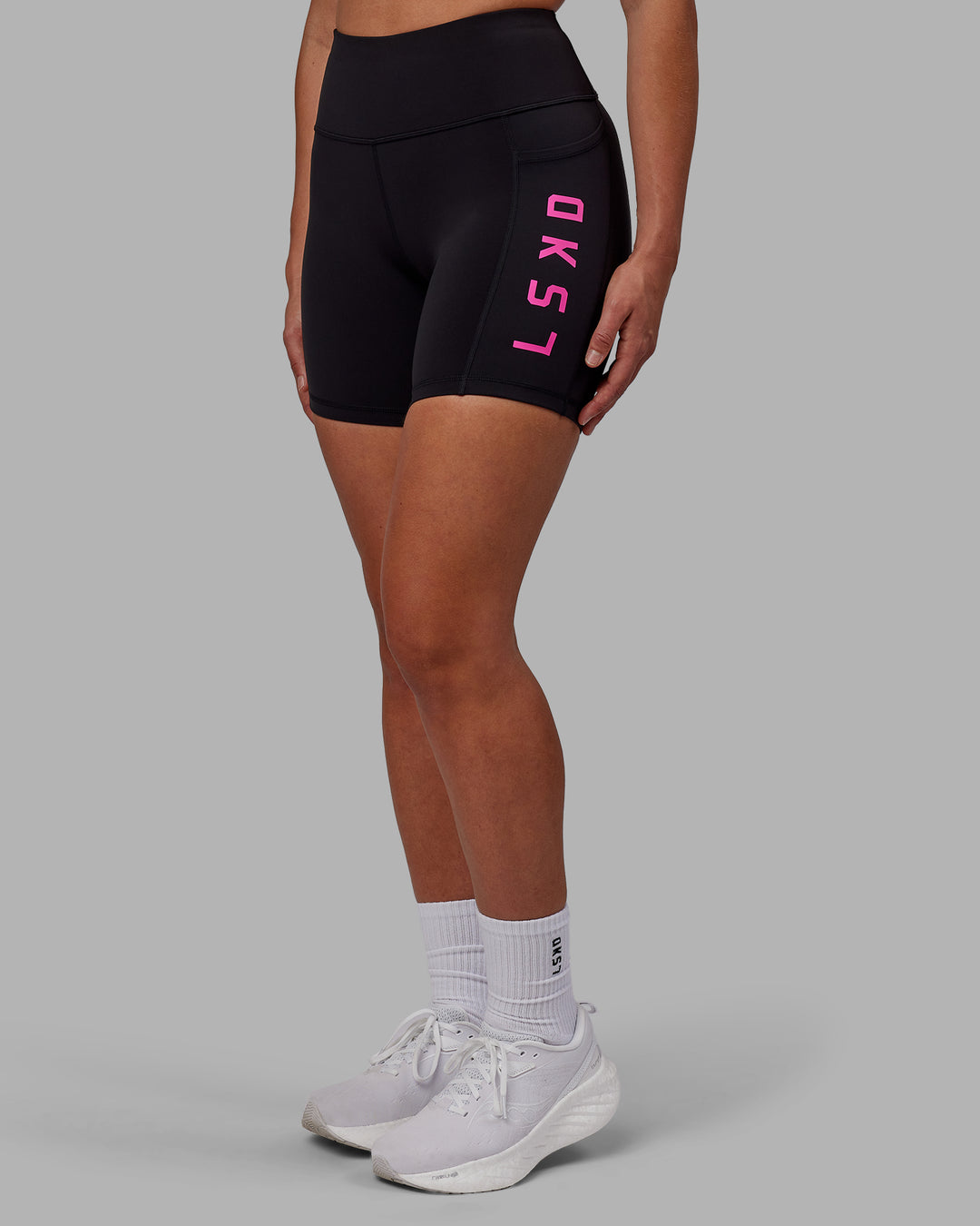 Woman wearing Rep Mid Short Tights - Black-Fuchsia Pink