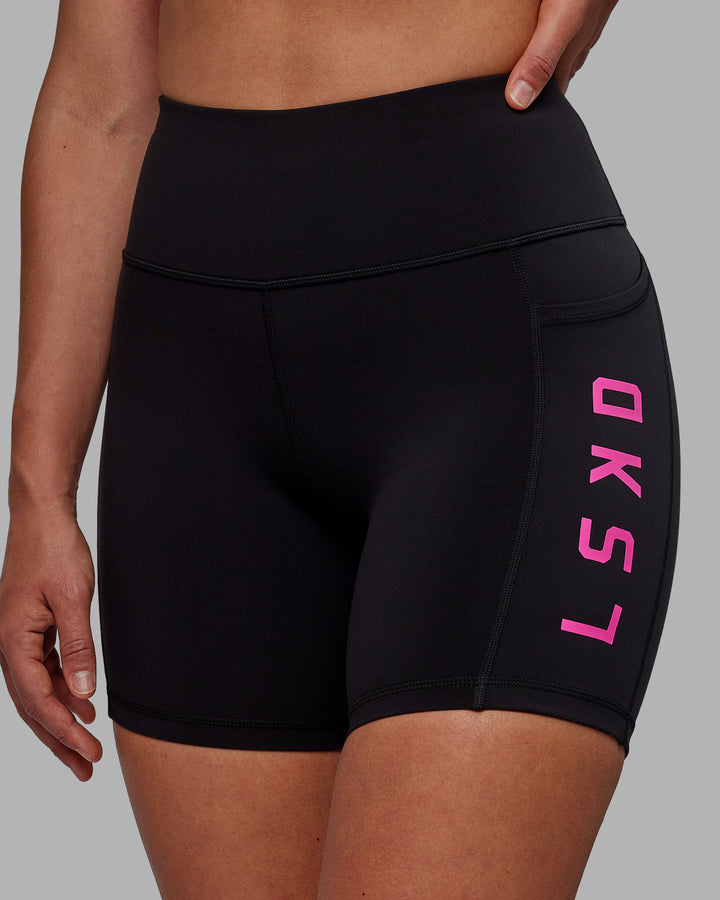 Woman wearing Rep Mid Short Tights - Black-Fuchsia Pink
