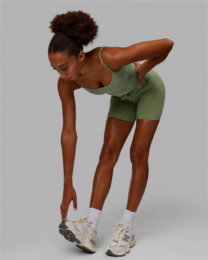 Woman wearing Resistance Mid Short Tights - Bayleaf
