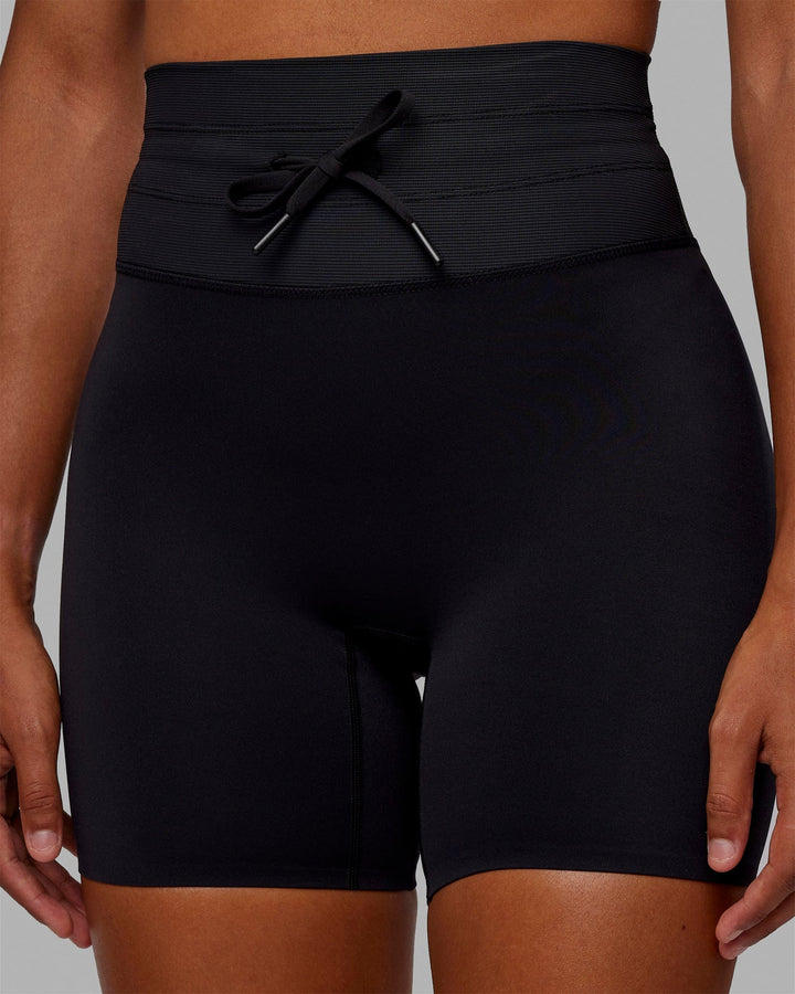 Woman wearing Resistance Mid Short Tights - Black
