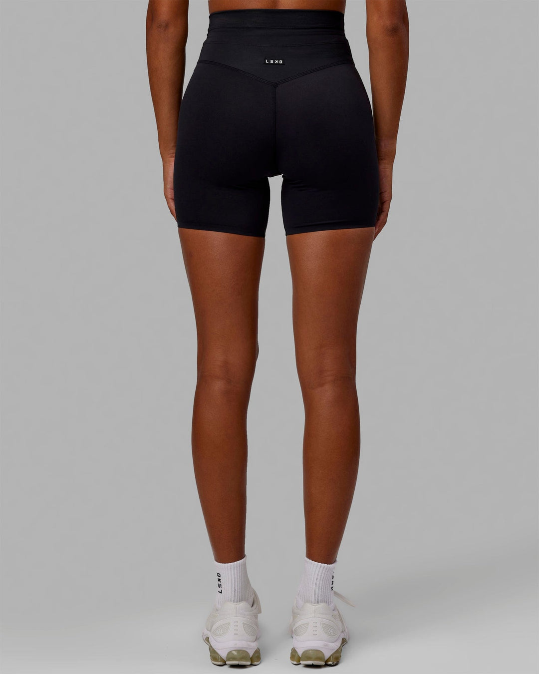 Woman wearing Resistance Mid Short Tights - Black