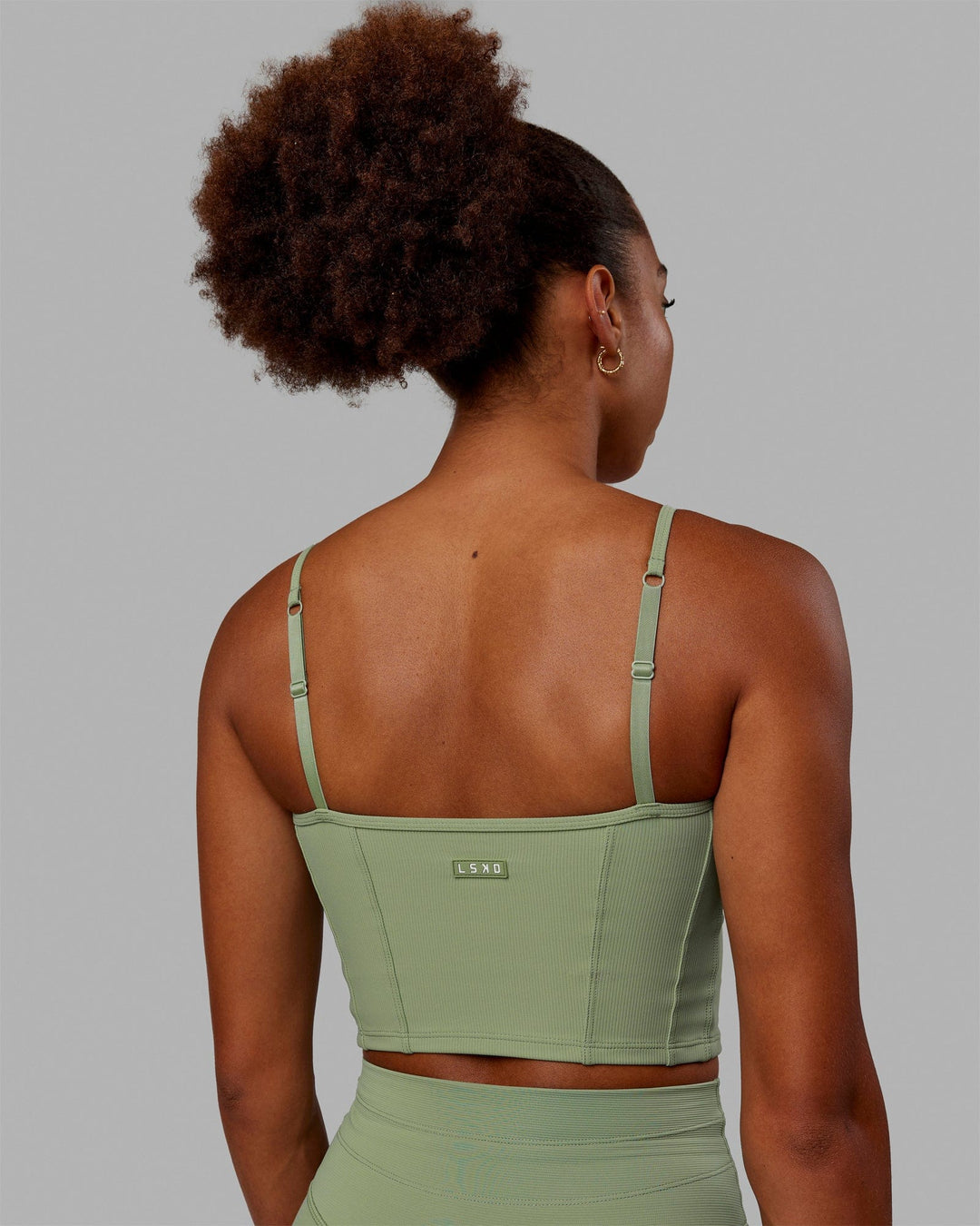 Woman wearing Resistance Ribbed Shelf Bra Performance Tank - Bayleaf