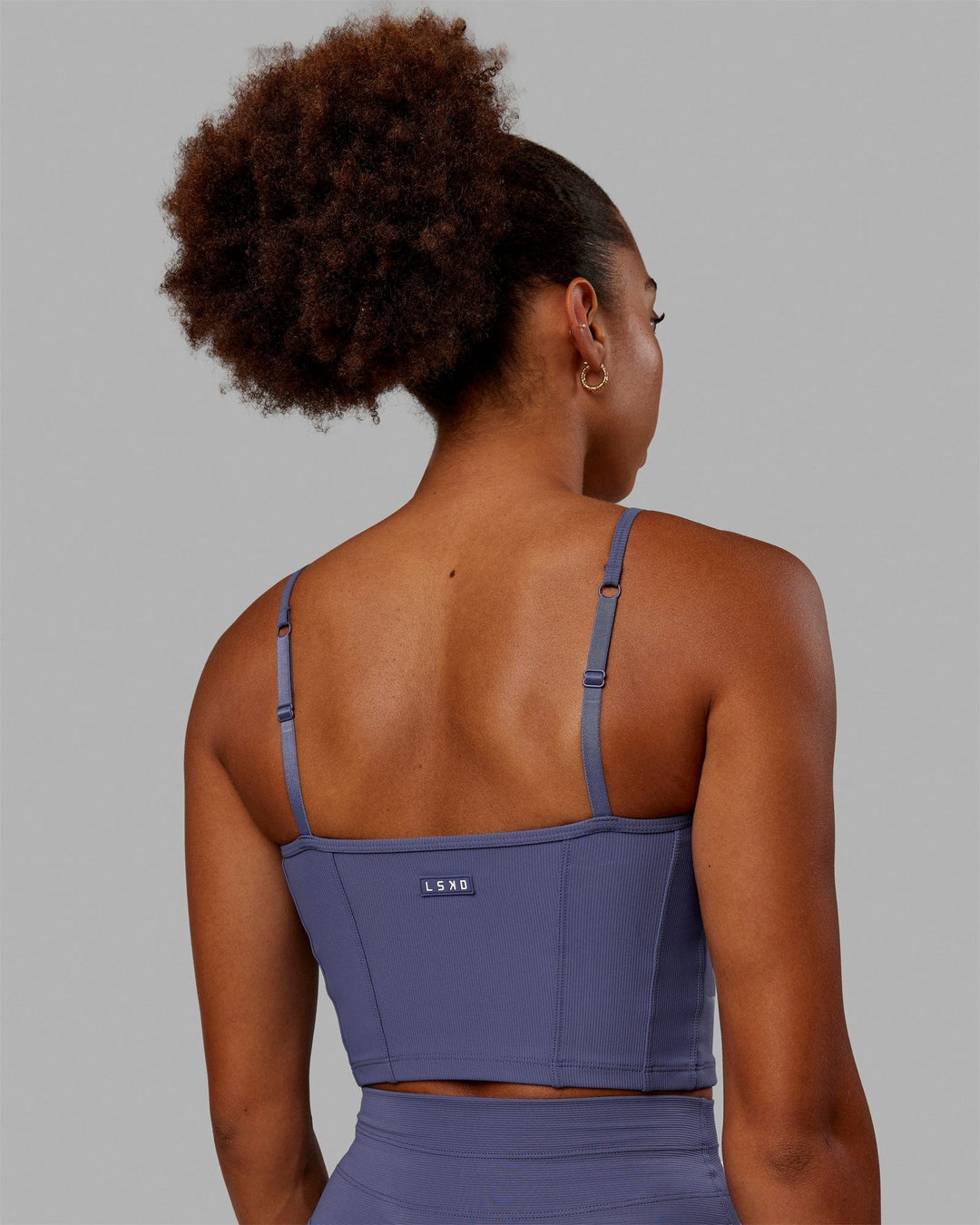 Woman wearing Resistance Ribbed Shelf Bra Performance Tank - Future Dusk