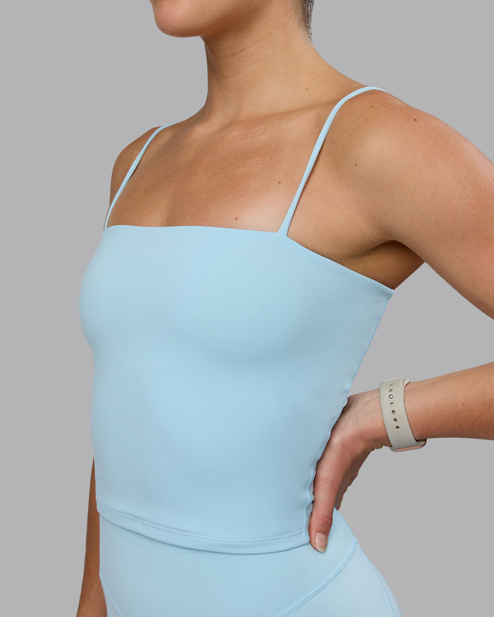 Woman wearing Revive Shelf Bra Tank - Crystal Blue
