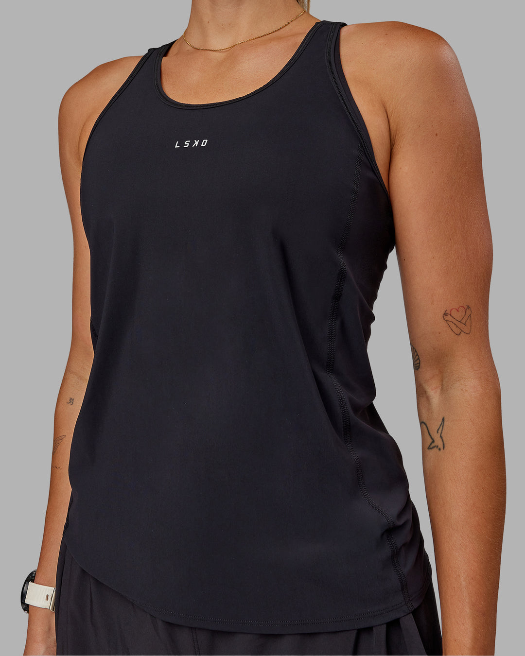 Woman wearing Rush Performance Tank - Black