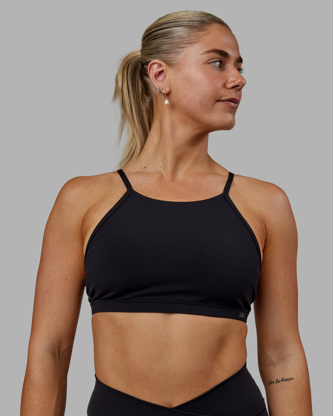 Woman wearing Sara Ares High Neck Sports Bra - Black