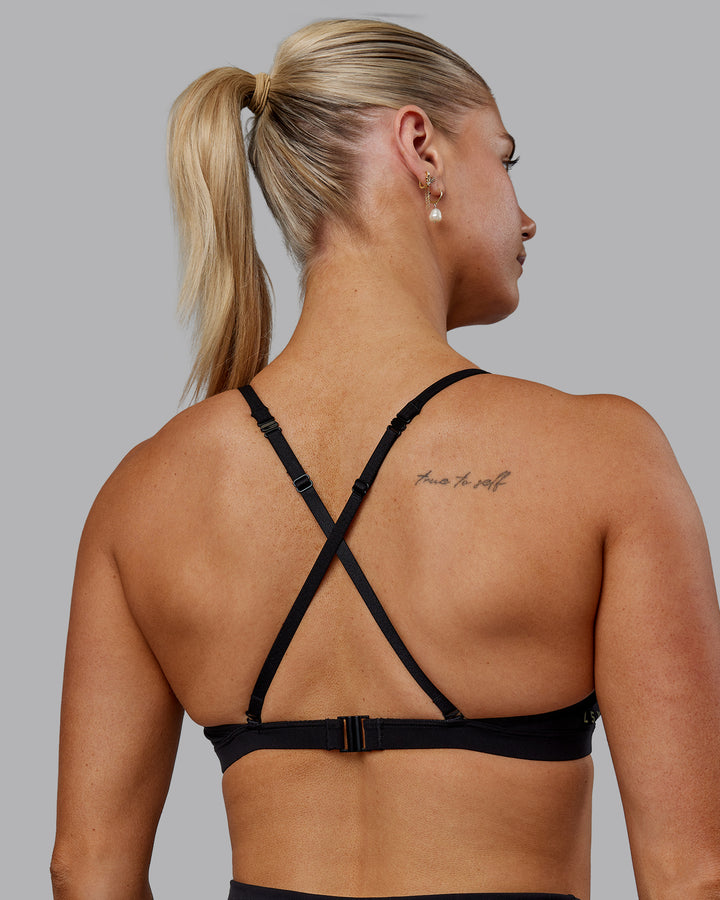 Woman wearing Sara Ares High Neck Sports Bra - Black
