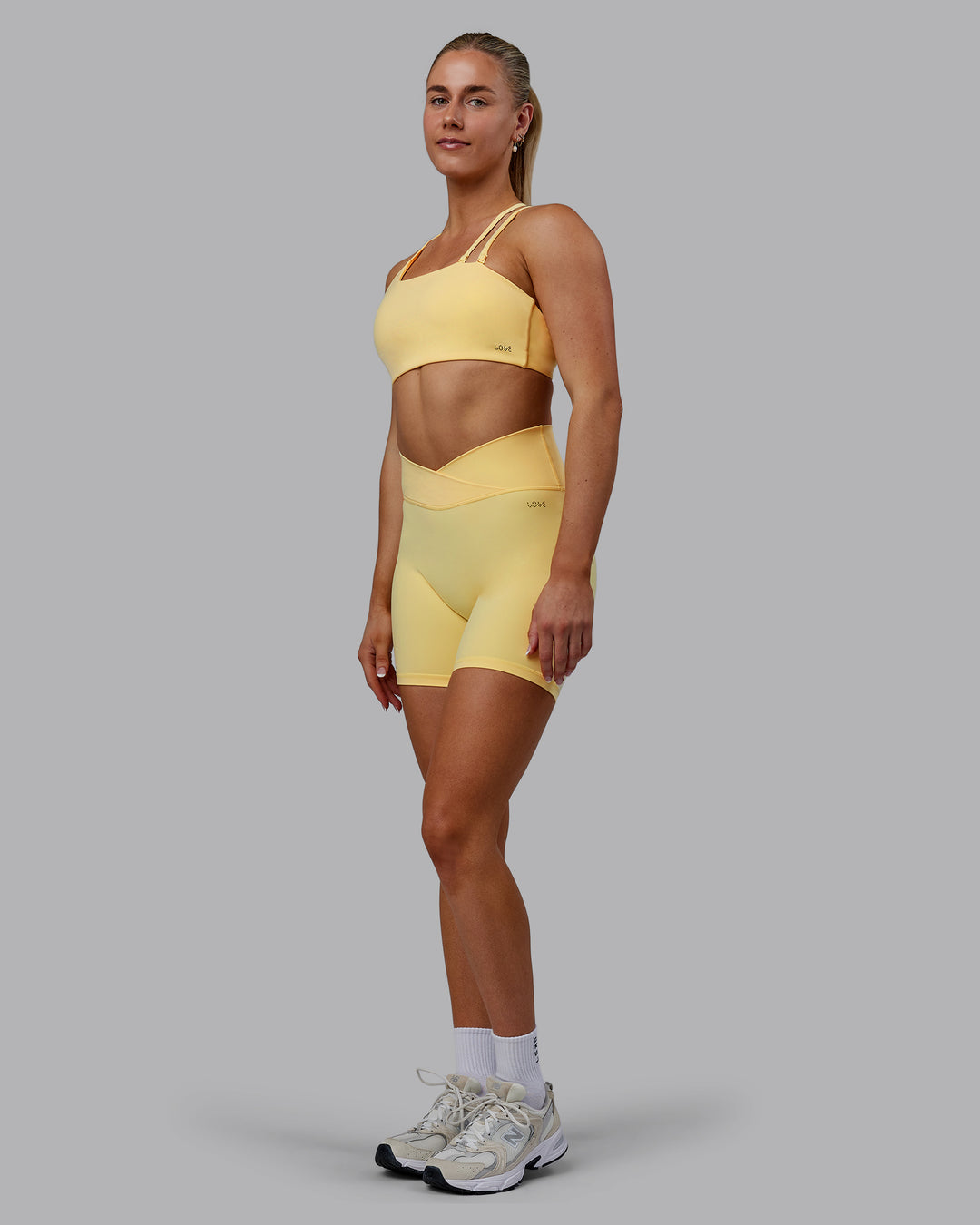 Woman wearing Sara Helios Sports Bra - Sunflower