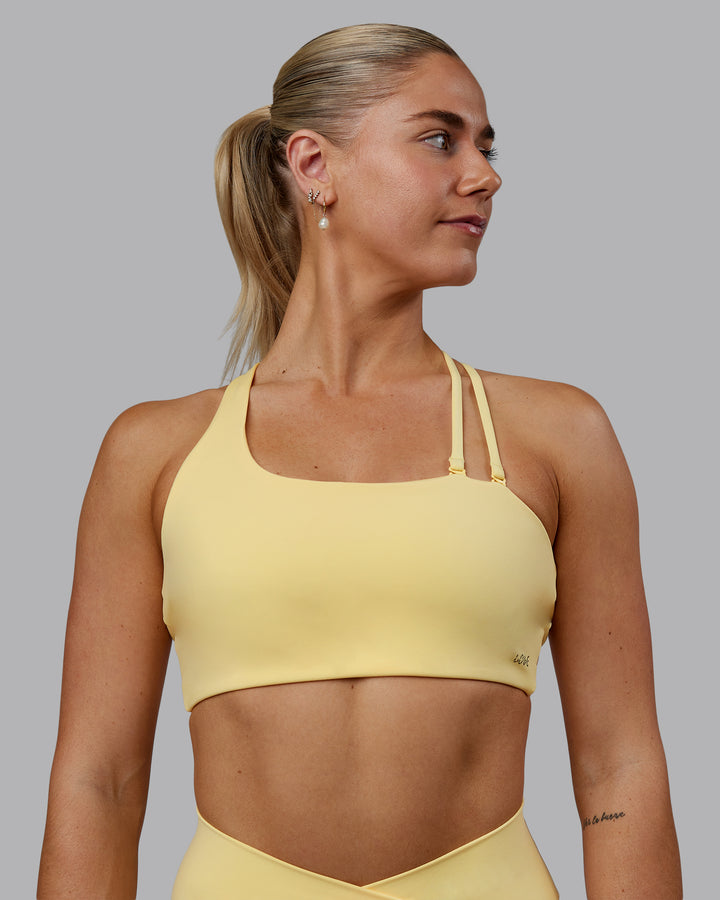 Woman wearing Sara Helios Sports Bra - Sunflower
