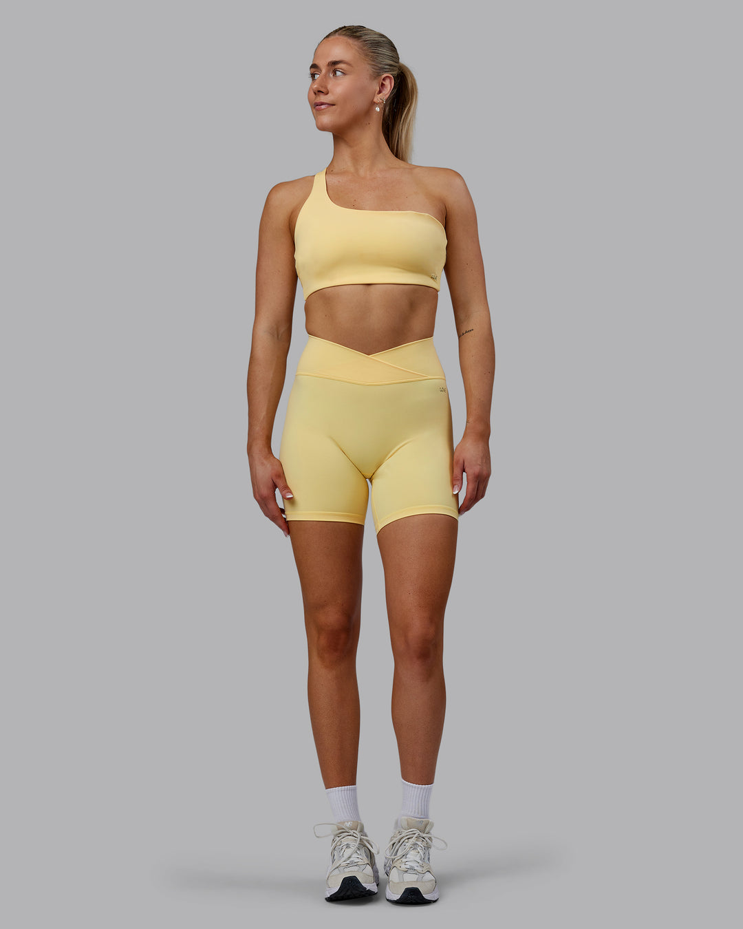 Woman wearing Sara Helios Sports Bra - Sunflower