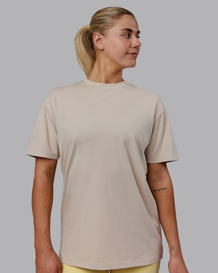 Woman wearing Sara I Can Shall &amp; Will FLXCotton Tee Oversize - Shale Beige-White
