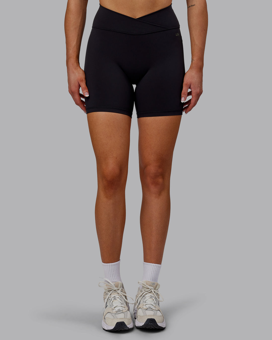 Woman wearing Sara Strike Cross Over Waist Mid Short Tights - Black