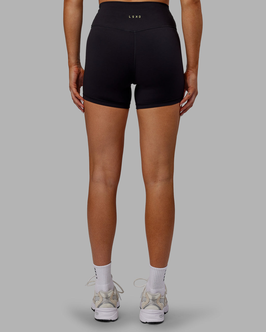 Woman wearing Sara Strike Cross Over Waist X-Short Tights - Black