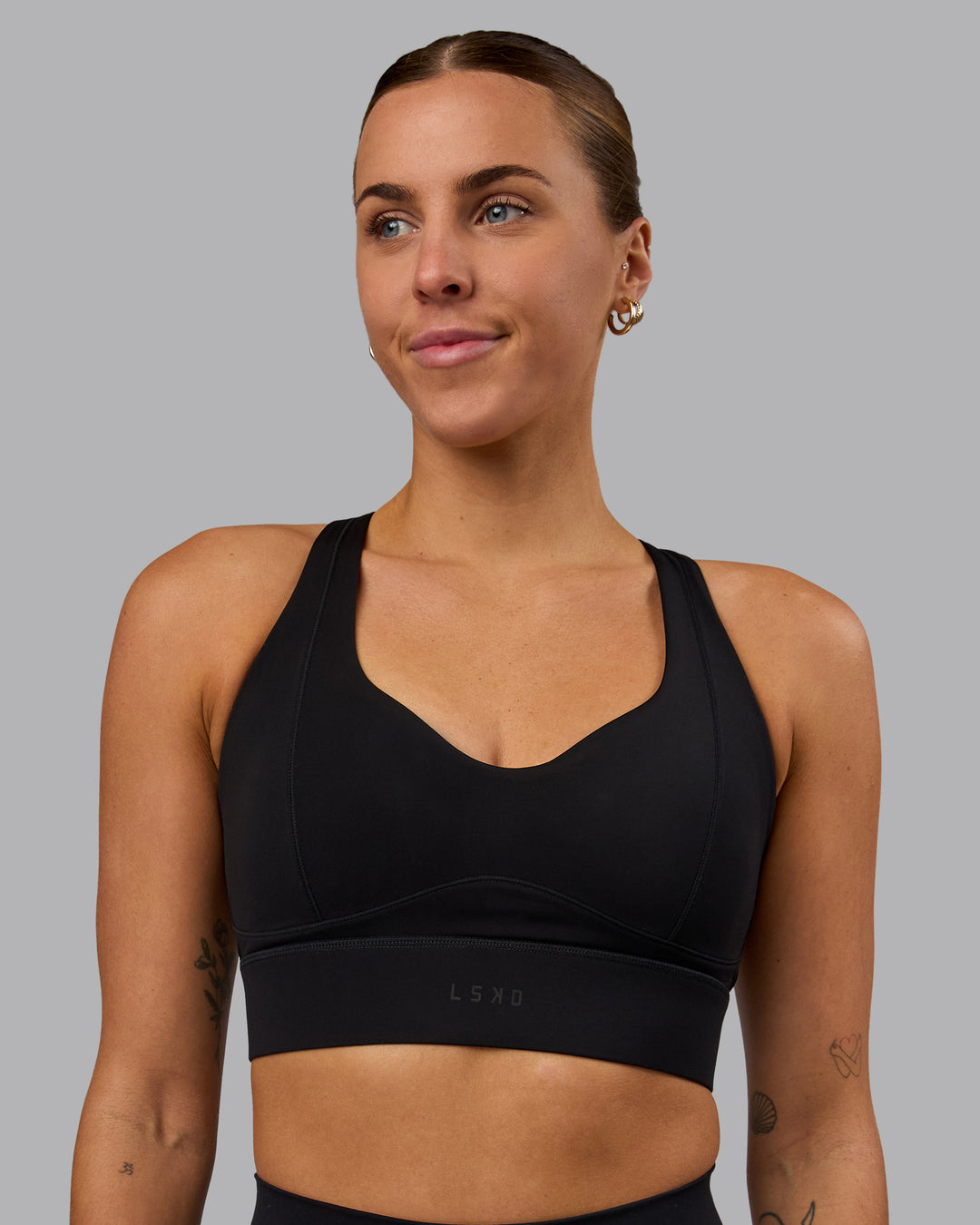 Woman wearing Sculpt Sports Bra - Black