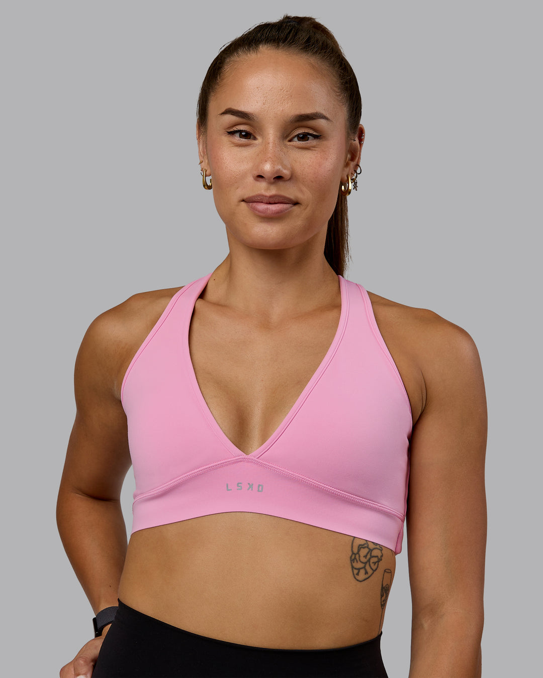 Woman wearing Stamina Sports Bra - Bubblegum