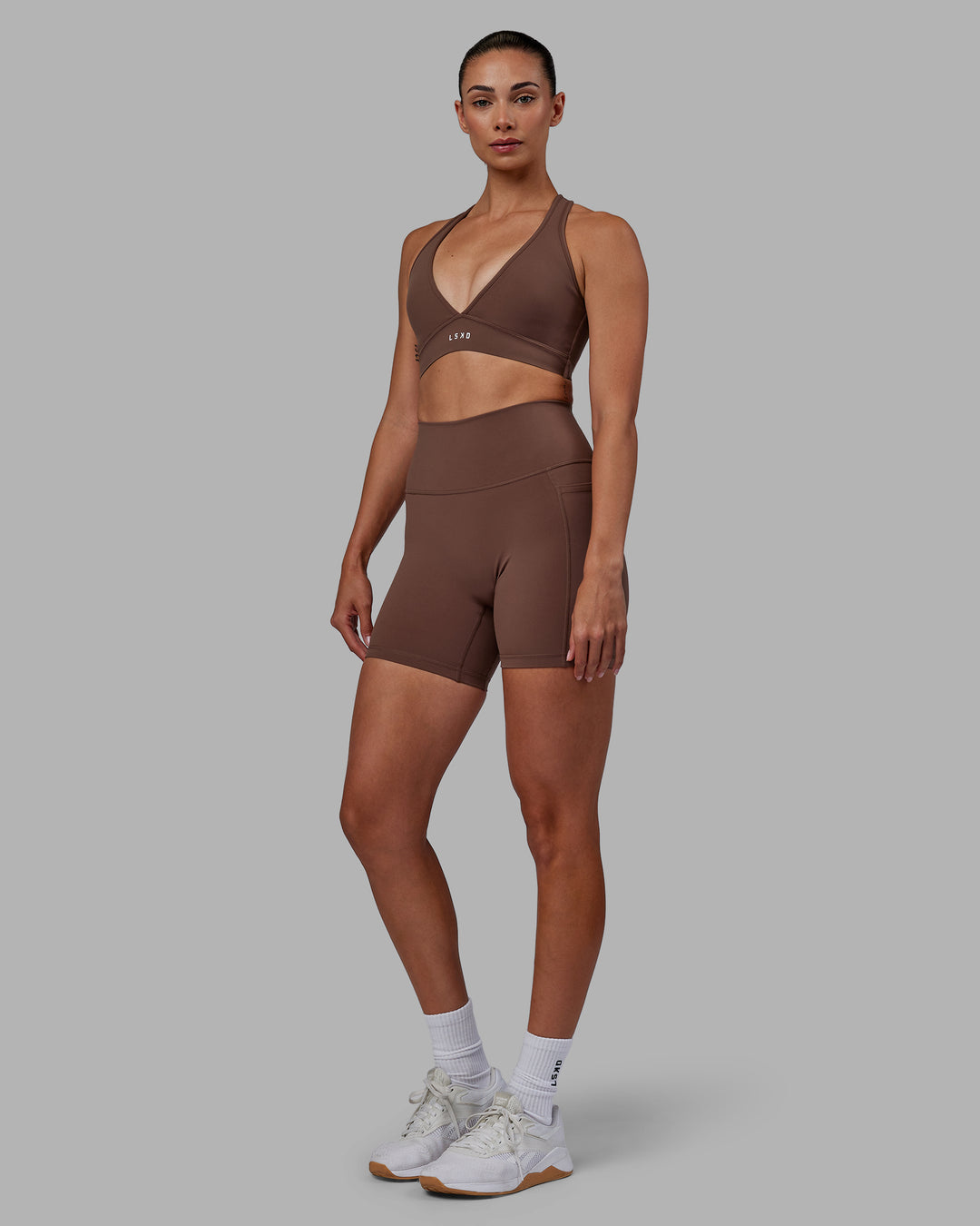 Woman wearing Stamina Sports Bra - Dull Rust