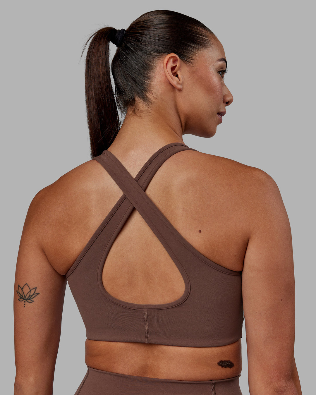 Woman wearing Stamina Sports Bra - Dull Rust