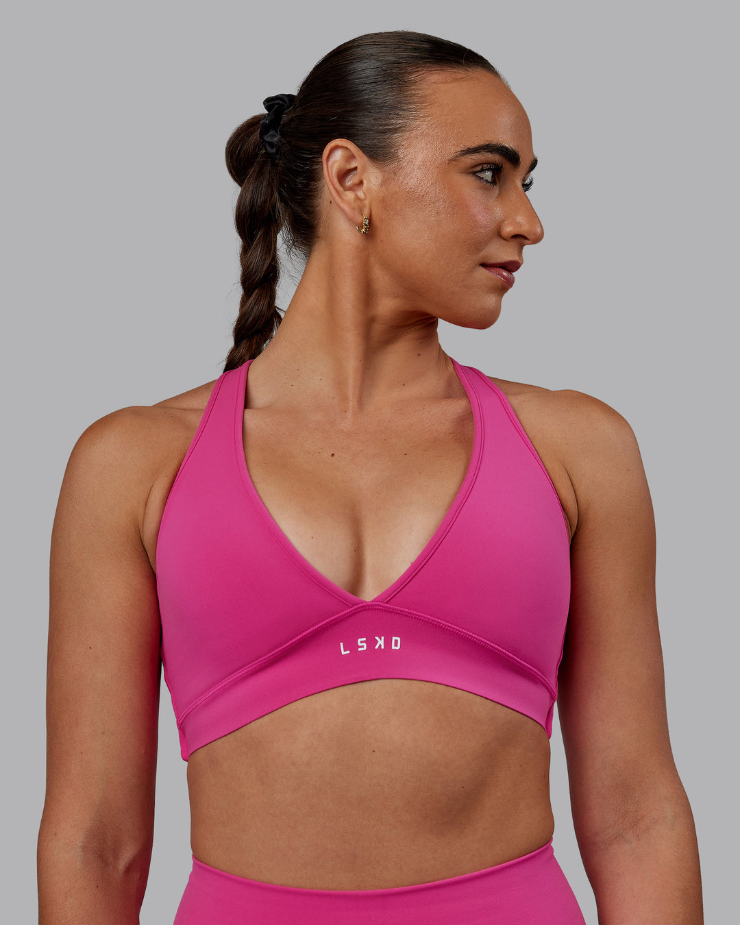 Woman wearing Stamina Sports Bra - Fuchsia Pink