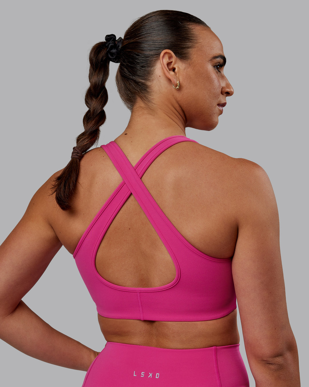 Woman wearing Stamina Sports Bra - Fuchsia Pink