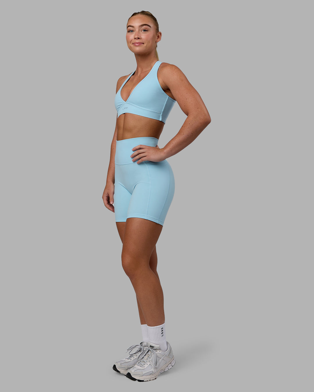 Woman wearing Stamina Sports Bra - Glacial Blue