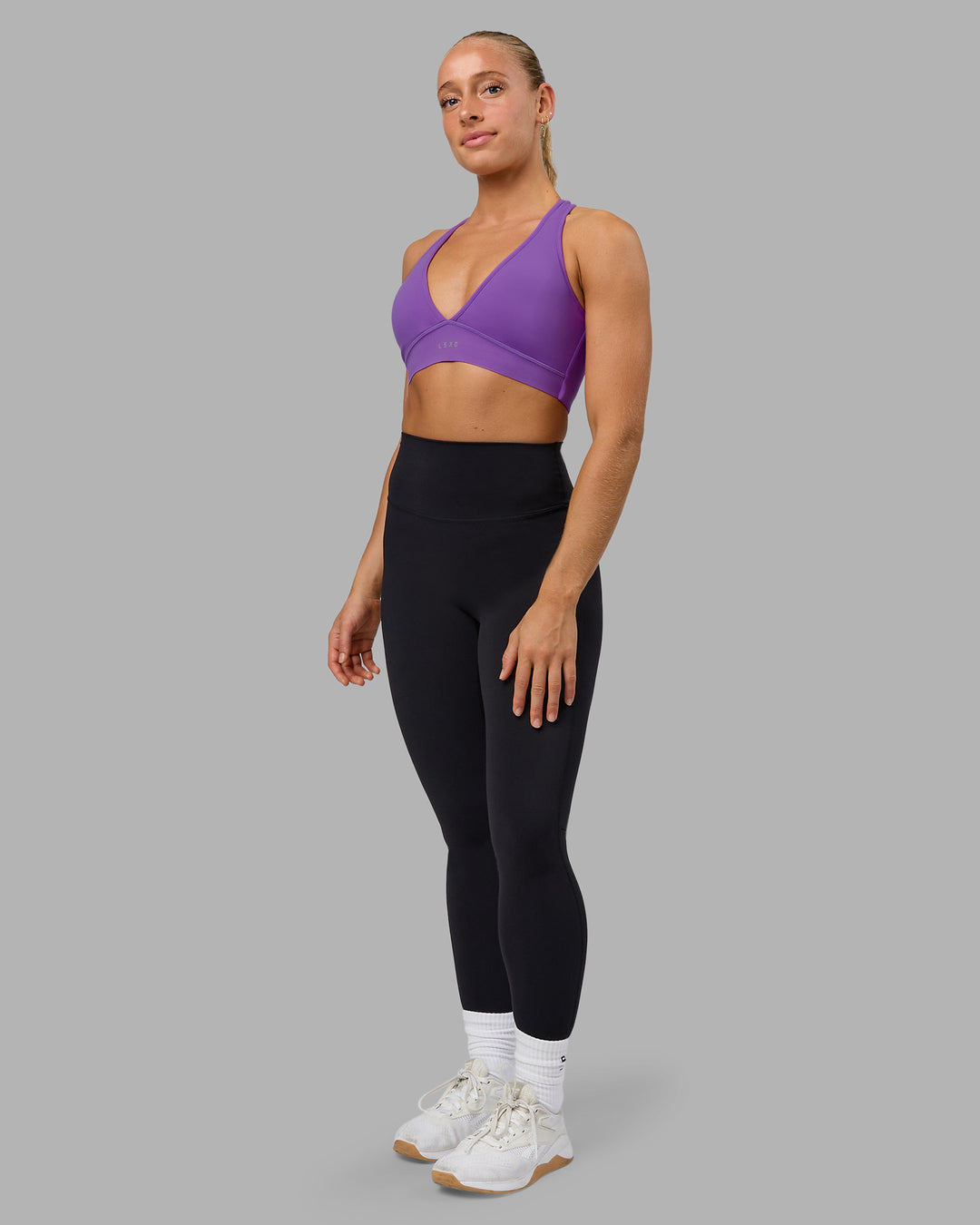 Woman wearing Stamina Sports Bra - Purple Swirl