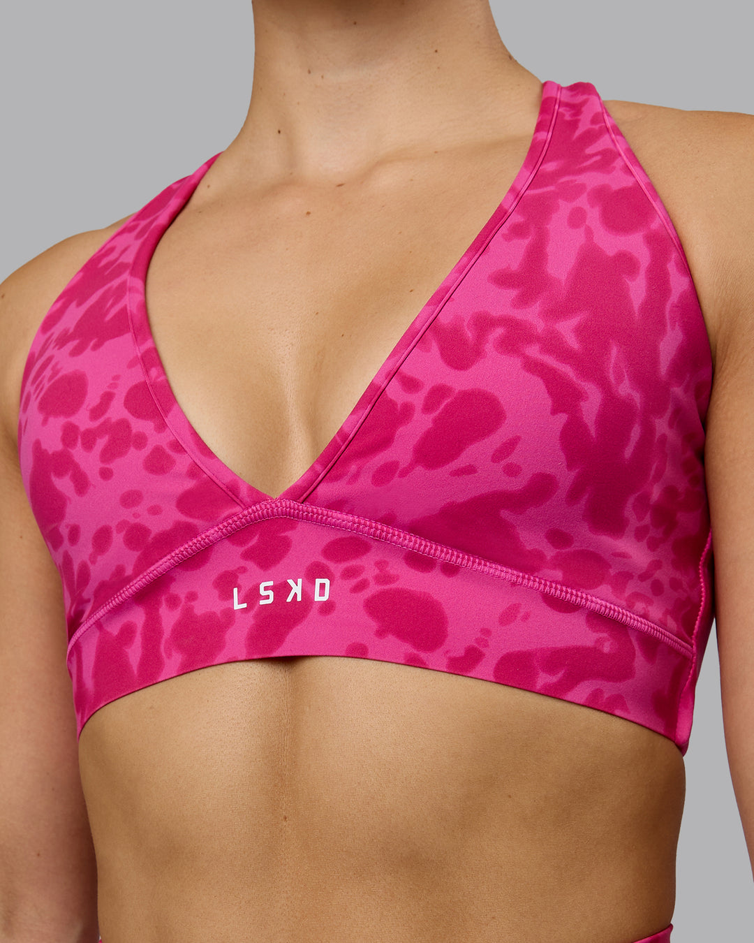 Woman wearing Stamina Sports Bra - Strawberry-Lava Lamp