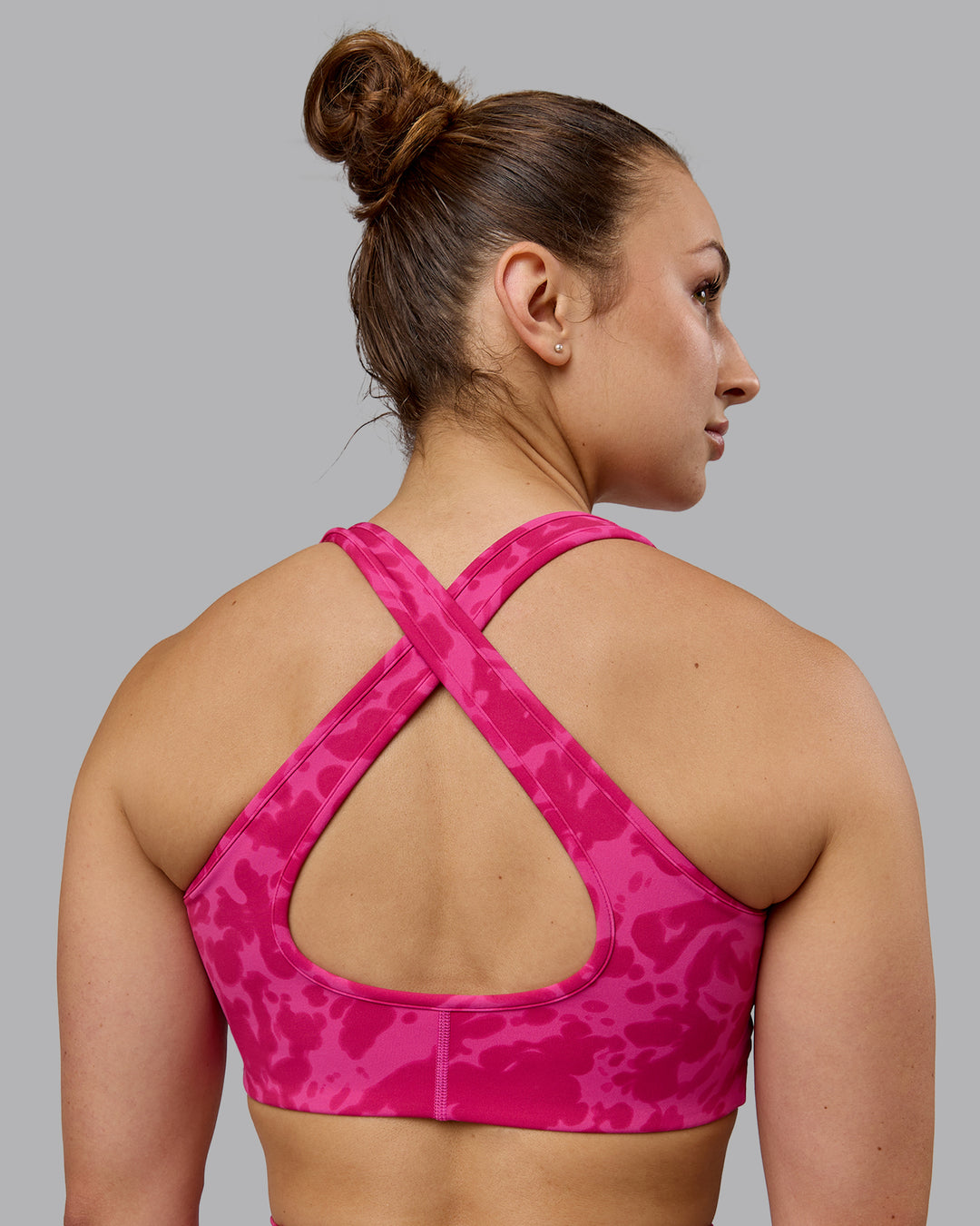 Woman wearing Stamina Sports Bra - Strawberry-Lava Lamp