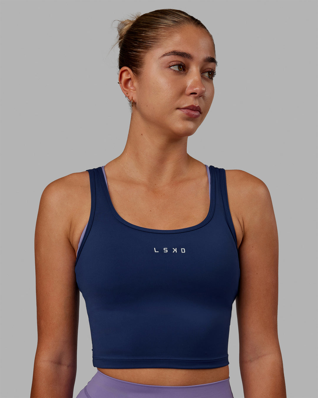 Woman wearing Staple Active Cropped Tank - Midnight Blue