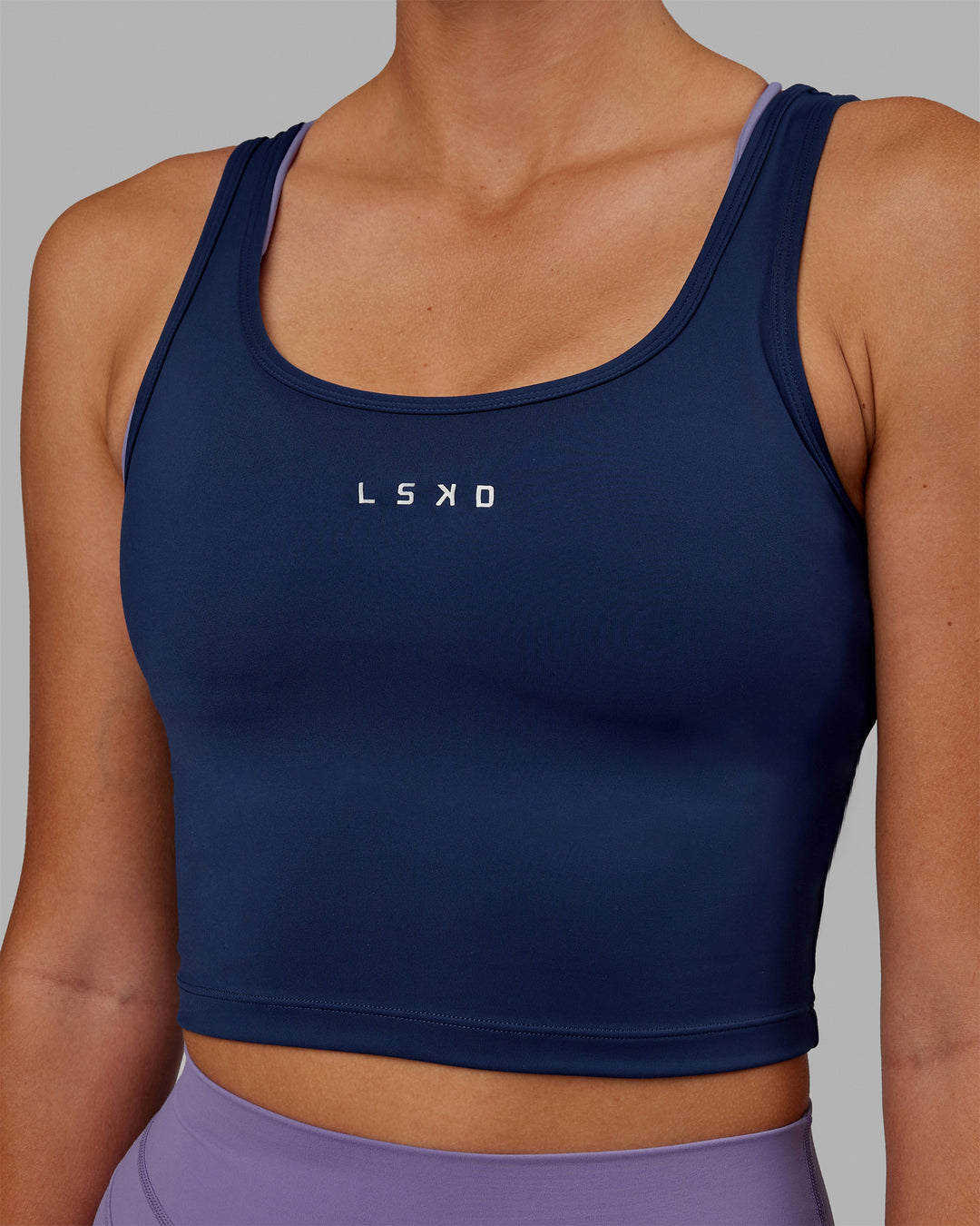 Woman wearing Staple Active Cropped Tank - Midnight Blue