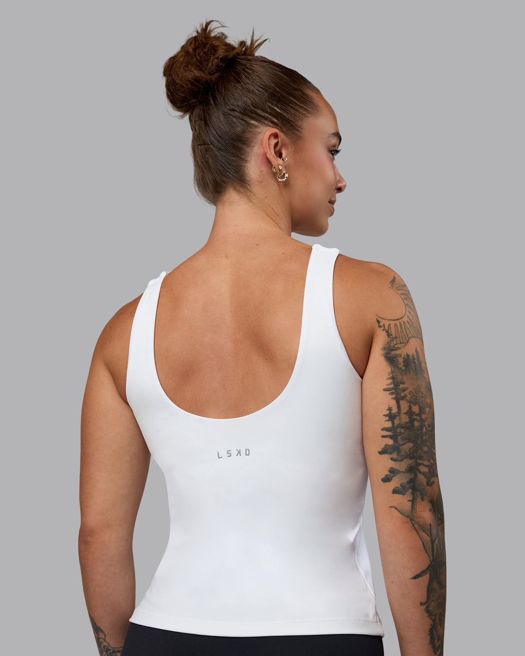 Woman wearing Staple Active Shelf Bra Tank - White